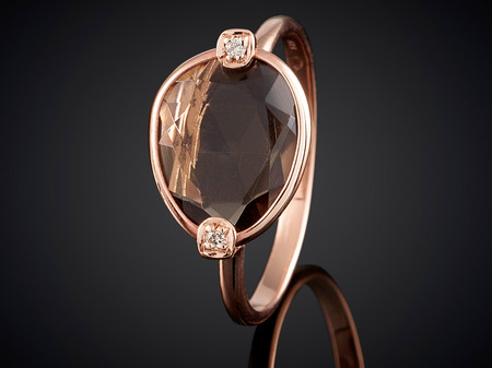 Golden ring with gemstone isolated on black background.の写真素材