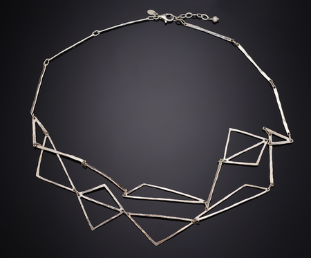 Golden necklace with isolated on black background.の写真素材