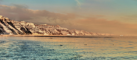 iceberg floating in greenland fjord.の写真素材