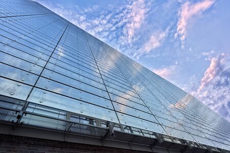 Modern building glass facade with reflections and colours.
