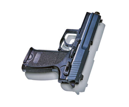 pistol isolated on white background with hard shadow.の写真素材
