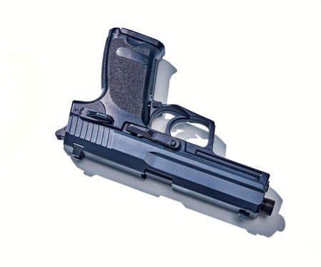 pistol isolated on white background with hard shadow.の写真素材