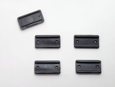 Five black plastic gliding coasters for feet of table. For the bottom of any furnitureの写真素材