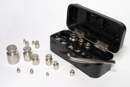 set of weights for laboratory measurements. Hard case with latch. Steel tweezersの写真素材