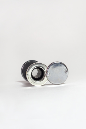 view through the door peephole from the back side. Chromed back cover on rivets with small handleの写真素材