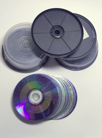 disc cake boxes with threaded transparent protection covers and solid black plastic bottoms. heap of...