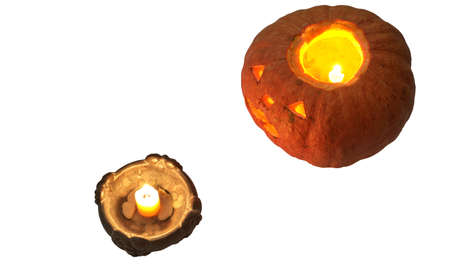halloween pumpkin with a lighted candle, at the candlestick. isolated on white backgroundの写真素材
