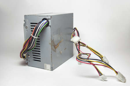 computer ATX power supply unit front side with ventilation openings. colorful power cords for conneting to drives directly from non-modular caseの写真素材