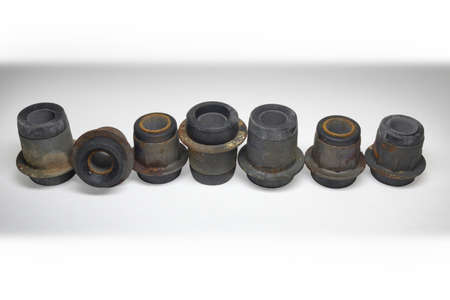silent blocks of suspension levers, bushings, rubber inserts, set, worn out, isolated on white backgroundの写真素材