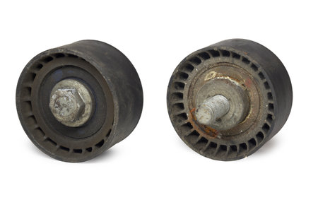 timing belt idler. Pair of rollers, pulley with bolt, used, bith sides, isolated on white backgroundの写真素材