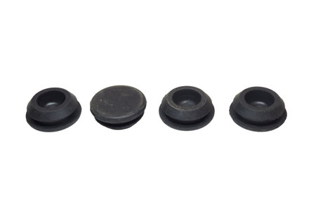 car body hole plugs. kit of rubber plugs for holes of car bottom, isolated on white backgroundの写真素材