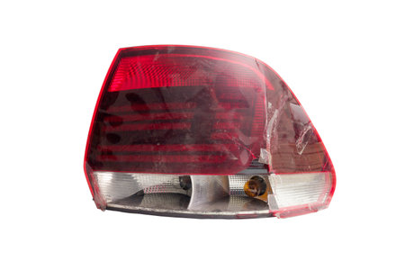 tail light of sedan body car. broken plastic lens isolated on white backgroundの写真素材