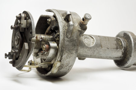 distributor of mechanical (conventional) ignition system closeup. contact breaker, rotor arm, housing on shaftの写真素材