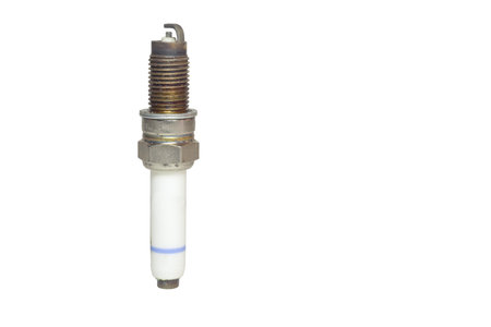 used spark plug, blue stripe on body of white insulator. isolated on white background