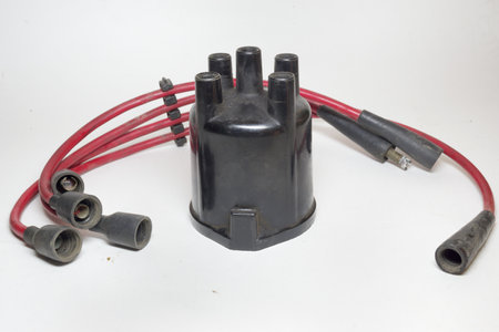 ignition distributor cap, set of high tension cables, 4-slot holder, rubber boots on terminalsの写真素材