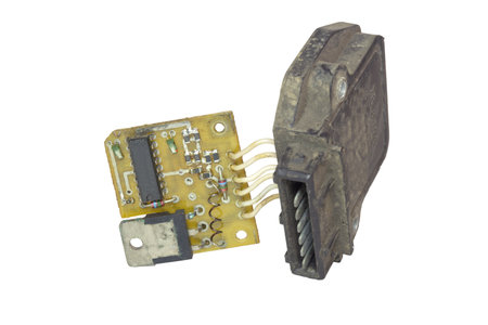 electronic ignition control module with pin blade terminal. main electronic board with hall sensor and its plastic cover. isolated on white backgroundの写真素材