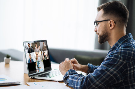 Video call, online business meeting, online education. Successful caucasian freelancer or student communicate with business colleagues or studying online via video conferenceの写真素材