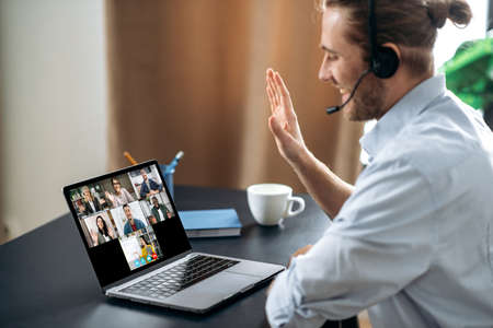 Group brainstorm, online video meeting, virtual conference with multiracial colleagues. Caucasian...