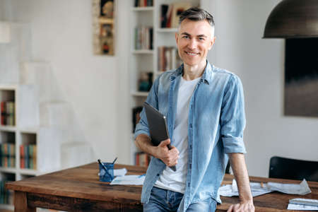 Portrait mature confident intelligent gray-haired caucasian man in casual stylish clothes, business...