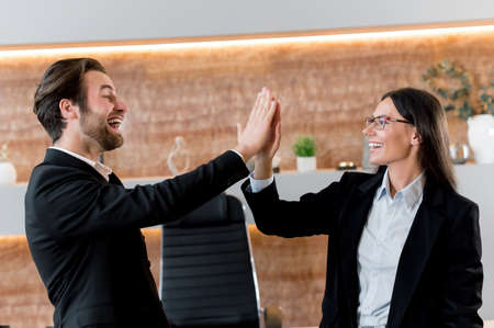 Positive successful young adult Caucasian business colleagues, managers, company employees, bank...
