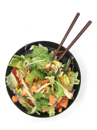 A healthy salad bowl with chopsticksの写真素材
