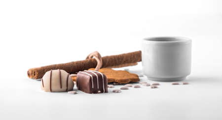 Assorted chocolate and cookies on white backgroundの写真素材