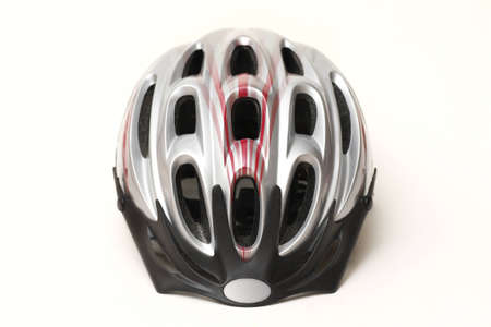 Close up of silver plastic unisexs bicycle helmet for adults isolated on white backgroundの写真素材