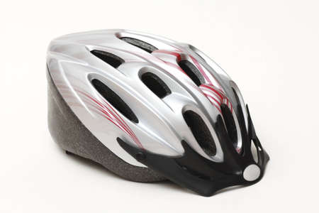 Side view of silver plastic unisexs bicycle helmet for adults close up isolated on white backgroundの写真素材