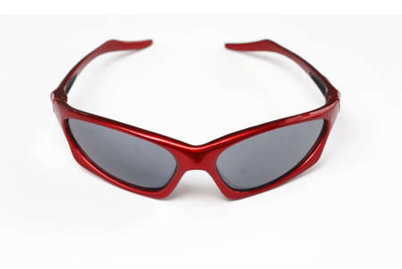Close up  of red sporty unisex shades isolated on white background