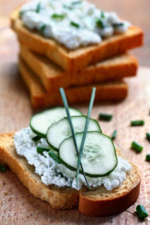 Close up of rusk spread with cottage cheese and chivesの写真素材
