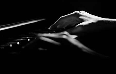 Close up of female hands playing keyboardの写真素材