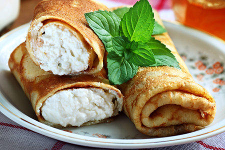 Rolled pancakes with cottage cheese close upの写真素材