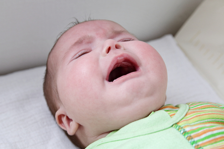 Close up of caucasian baby girl crying faceの写真素材