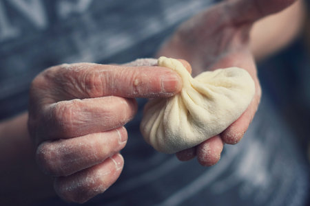 Close up of female hands holding Hinkの写真素材