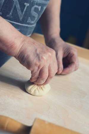 Close up of female hands making Hinkの写真素材