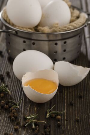 Fresh farm eggs on a wooden rustic backgroundの写真素材