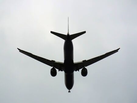 Plane flying up in the sky view from tail