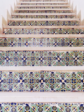 bright staircase covered with Arabic tiles pattern