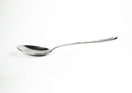 Silver spoon isolated on white background