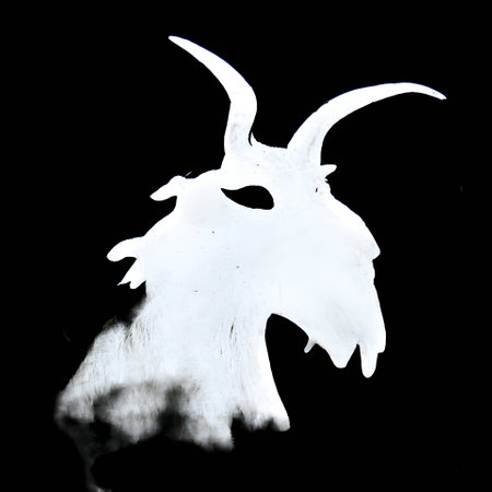 Vector illustration of a goat in white silhouette against a clean black background, capturing graceful forms.のイラスト素材