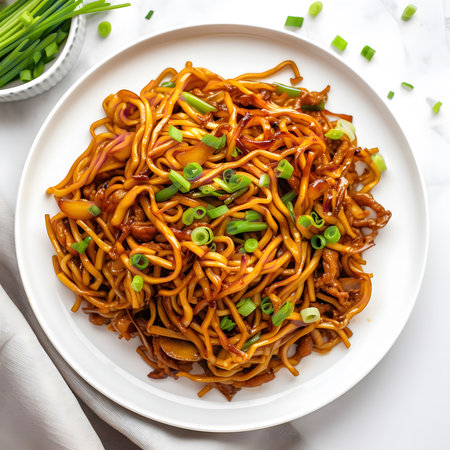 A mouthwatering plate of homemade pork lo mein. This delicious stir-fry features tender pork, savory mushrooms, and fresh green onions, all tossed in a rich, flavorful sauce.の写真素材