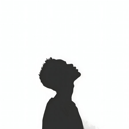 A striking monochrome silhouette of a person looking upwards, symbolizing hope, aspiration, and...