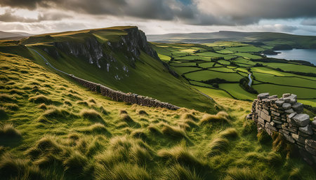 A picturesque view of rolling green hills, a winding road, and a distant lake. The scene is bathed...