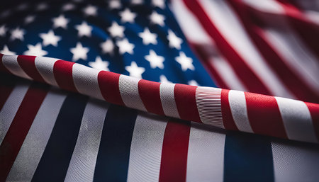 A close-up shot of the American flag, showcasing its red, white, and blue stripes and stars.の写真素材
