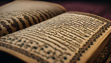 Close up of an open Quran with beautifully detailed calligraphy.の写真素材