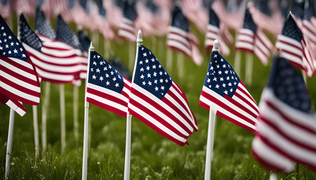 A field of American flags waving proudly in the wind, a patriotic display of national pride and...