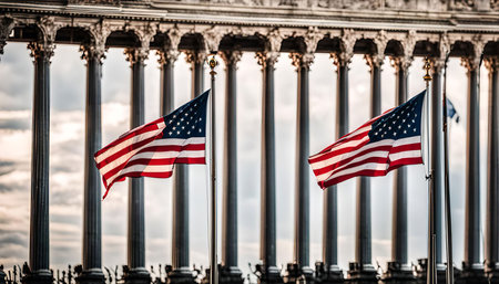Two American flags waving proudly in front of a row of columns, capturing a patriotic and historical moment.の写真素材
