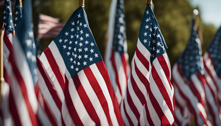A close-up image of American flags waving in the wind. The red, white, and blue colors are vibrant...