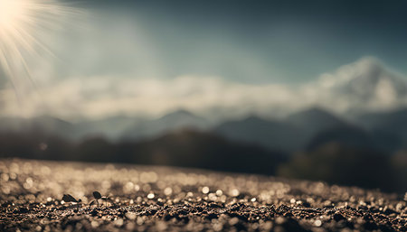 A small sprout emerges from the ground, reaching towards the sunlight against a backdrop of majestic...