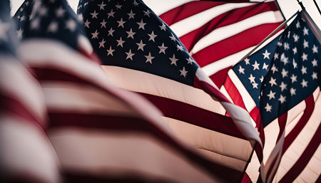 Three American flags waving in the wind, capturing a sense of patriotism and pride.